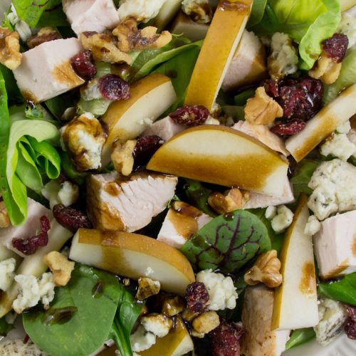 salad with pear, turkey, gorgonzola, walnuts, dried cranberries, and mixed greens