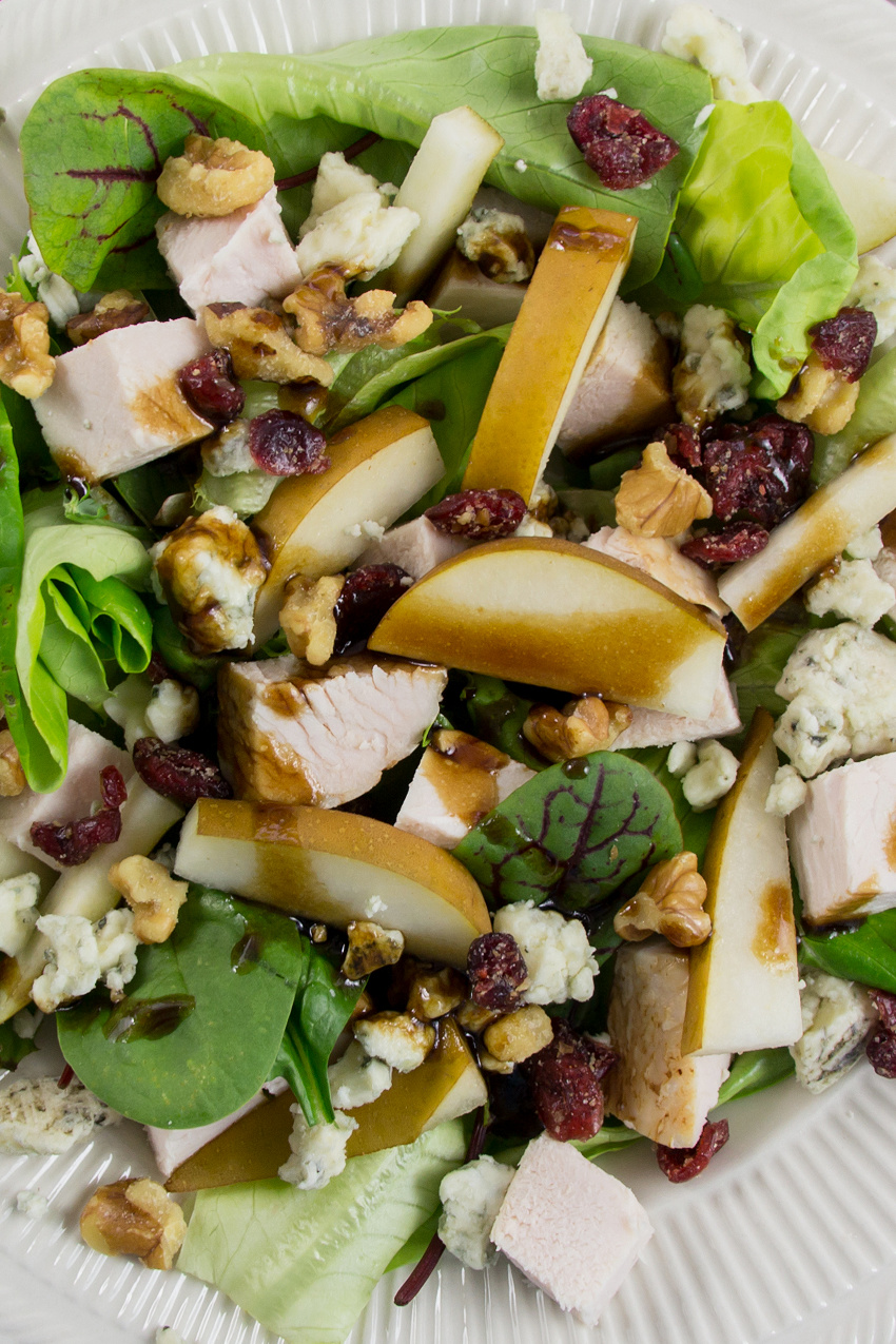 salad with pear, turkey, gorgonzola, walnuts, dried cranberries, and mixed greens