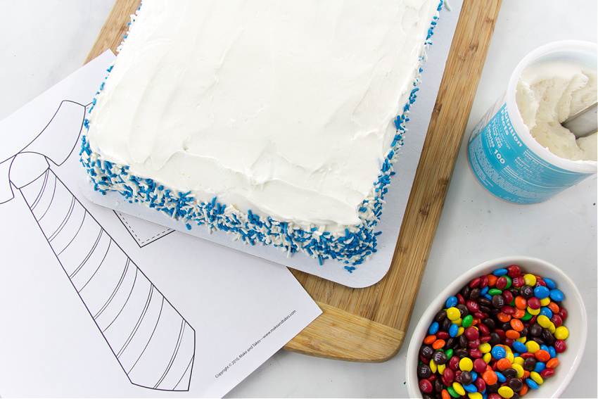 a sheet cake, mini m&ms and frosting for making a fathers day tie cake