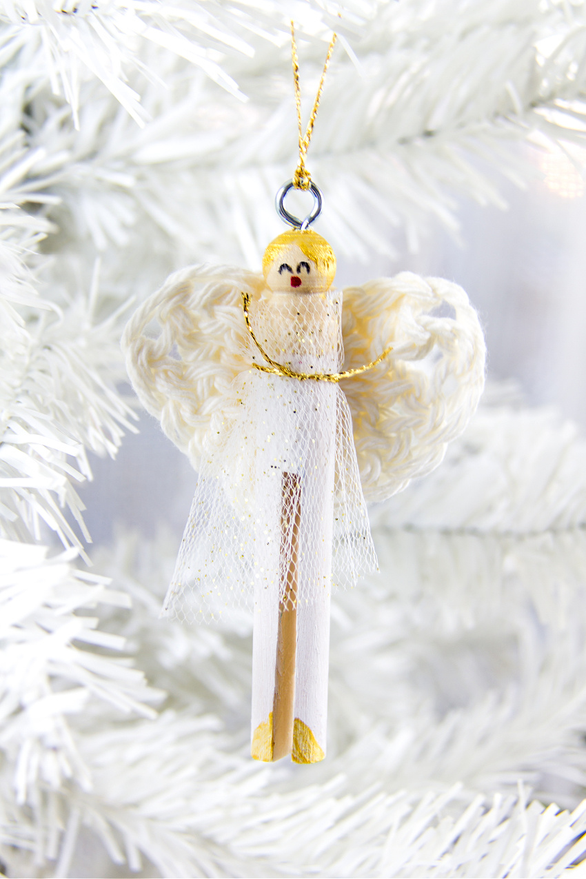 a DIY angel ornament made with a wood clothespin and crocheted wings