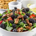 berry salad with pecans in a bowl