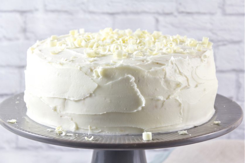 white cake on a grey cake stand