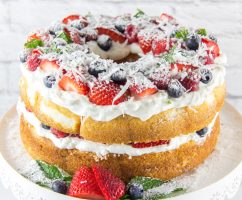 angel food cake decorated with berries and coconut for the 4th of July