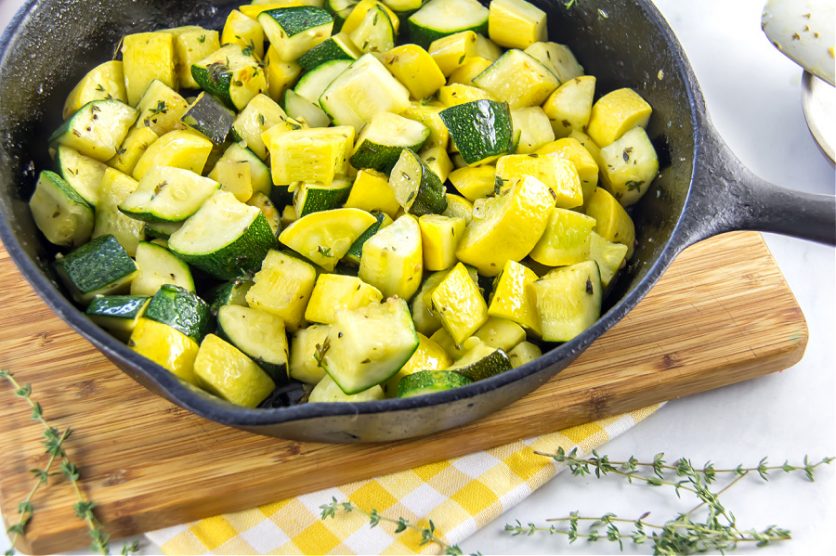 sauteed zucchini and summer squash in a cast iron skillet