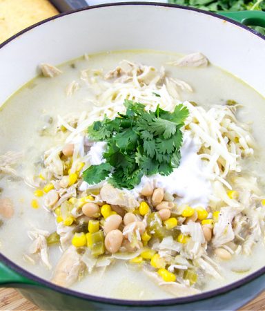 white chicken chili topped with cilantro, crema mexicana and monterey jack cheese