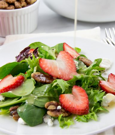 heart shaped strawberries on a salad