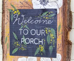 diy porch sign that is hand painted with flowers
