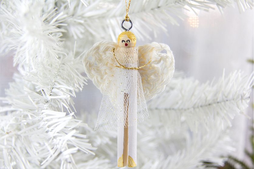 a DIY clothespin angel ornament with crocheted angel wings