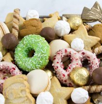 dessert tray for a christmas party with shortbread, meringue, wafers, chocolate, macarons