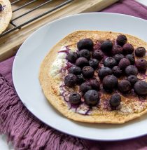 a tortilla topped with blueberries for a healthy kids breakfast