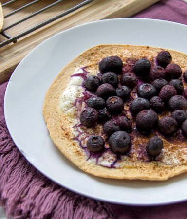 a tortilla topped with blueberries for a healthy kids breakfast