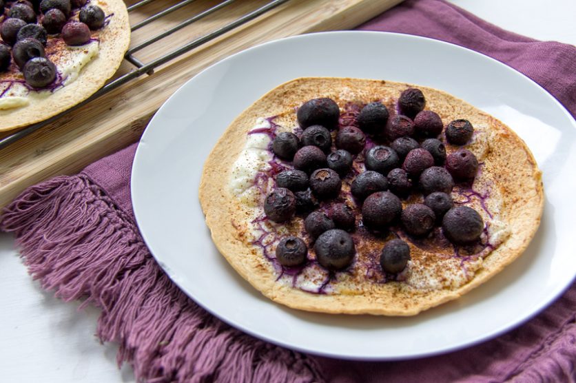 a tortilla topped with blueberries for a healthy kids breakfast