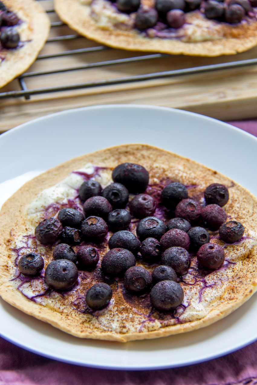 blueberries baked on a tortilla with cream cheese and cinnamon