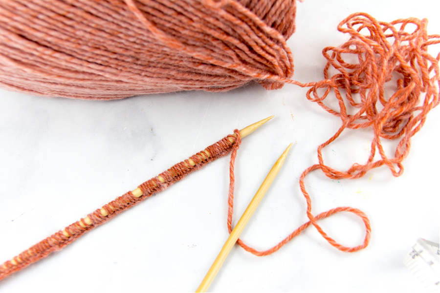 90 stitches cast onto straight needles to knit a beanie