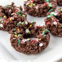 christmas chocolate crackles shaped like wreaths with festive nonpareils sprinkled over them.