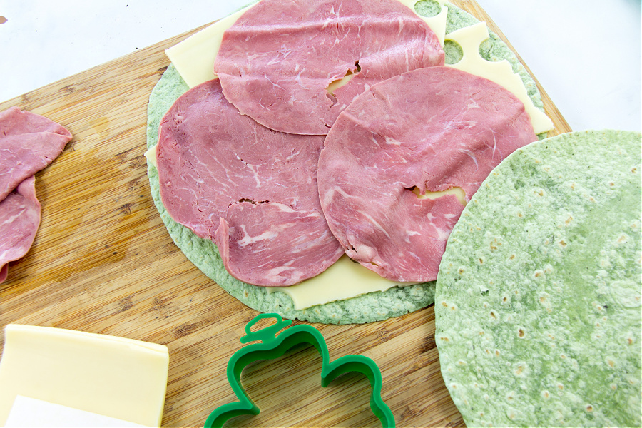 corned beef and swiss cheese on a spinach wrap