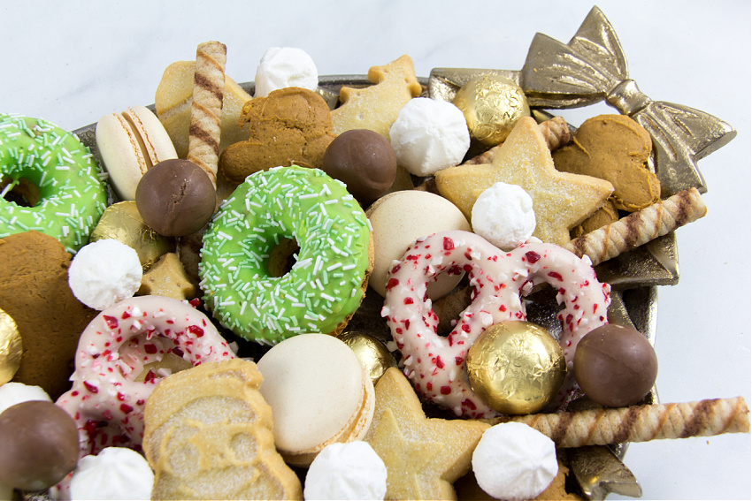 dessert tray for a christmas party with shortbread, meringue, wafers, chocolate, macarons
