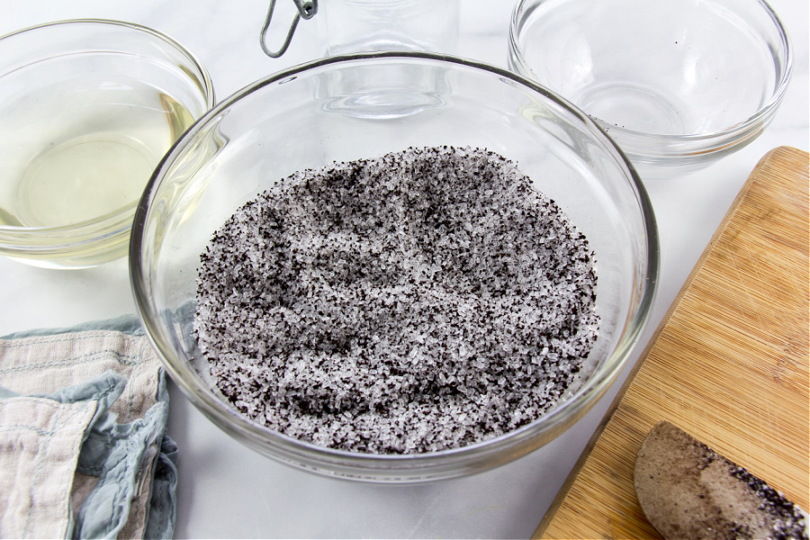 ground coffee and epsom salt in a bowl to make a coffee salt scrub