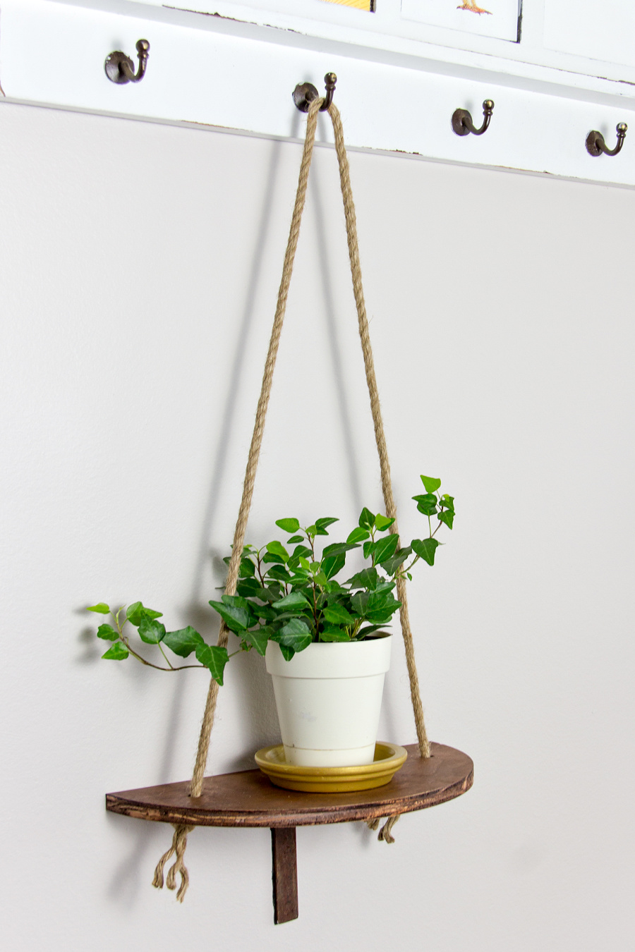 a semi-circle wood hanging planter
