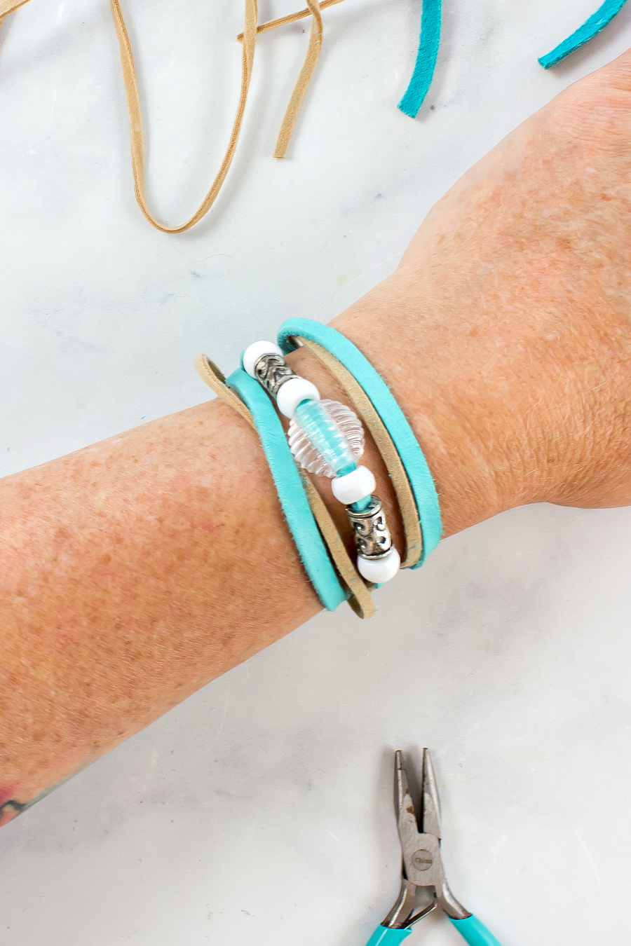 blue and tan faux leather wrap bracelet with beads
