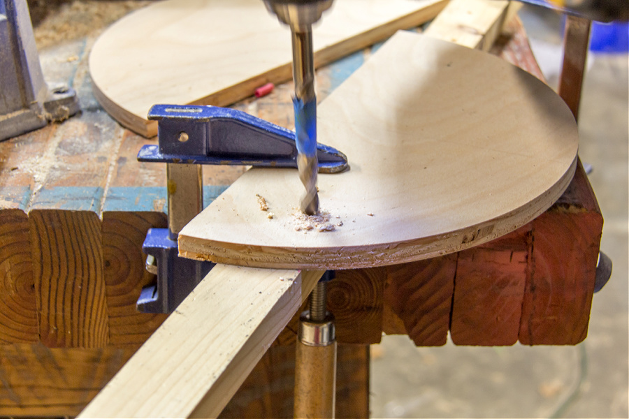 holes being drilled in wood to make a hanging planter