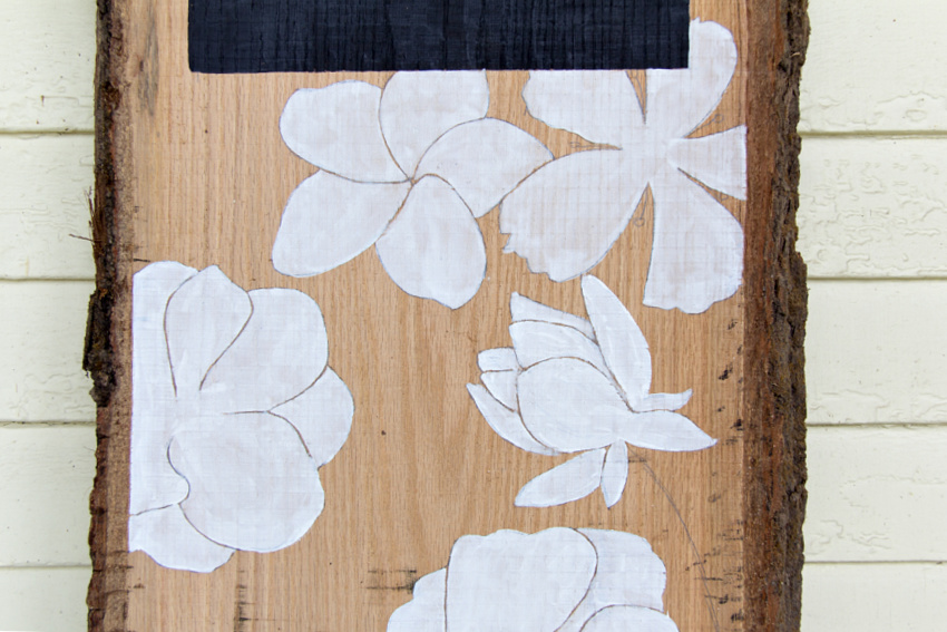 white flowers painted on wood