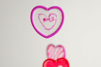 Hanging Dried Glue Hearts @makeandtakes.com