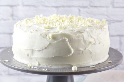 white cake on a grey cake stand