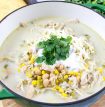 white chicken chili topped with cilantro, crema mexicana and monterey jack cheese
