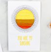 a homemade greeting card with a yarn scraps sun with the words you are my sunshine