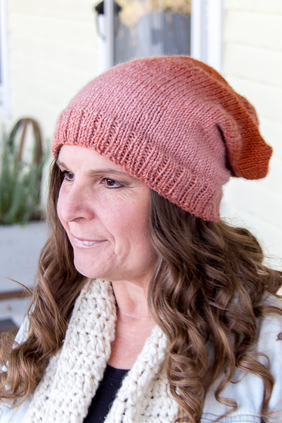 a pink slouchy knit hat with a free pattern to make it