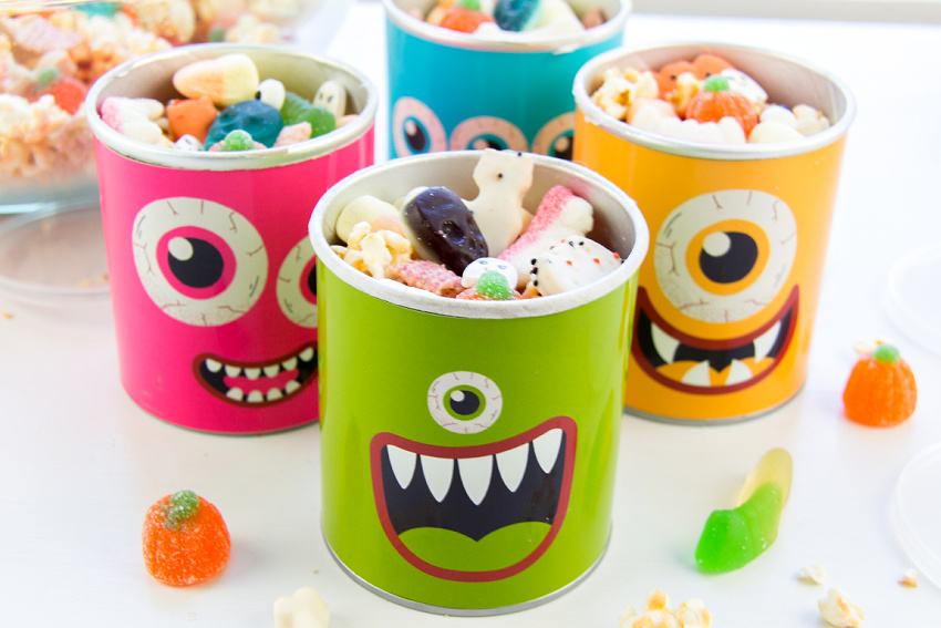 Halloween snack mix for kids put in old pringles and the good company potato chip containers