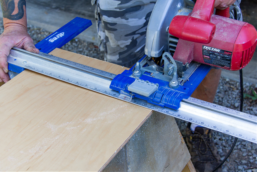 A saw being used to cut wood for a diy wood headboard project