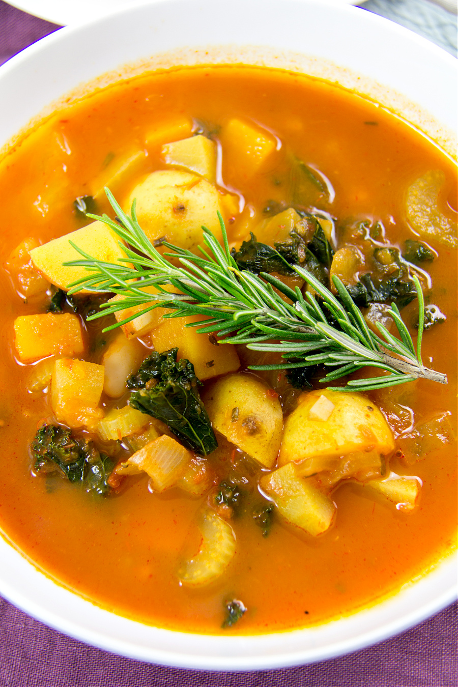 a harvest soup with potatoes, butternut squash, cucuzza squash, and kale