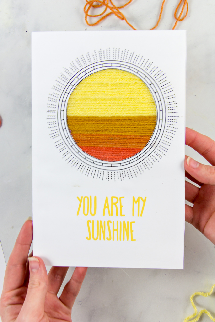 a homemade you are my sunshine greeting card made with yarn scraps