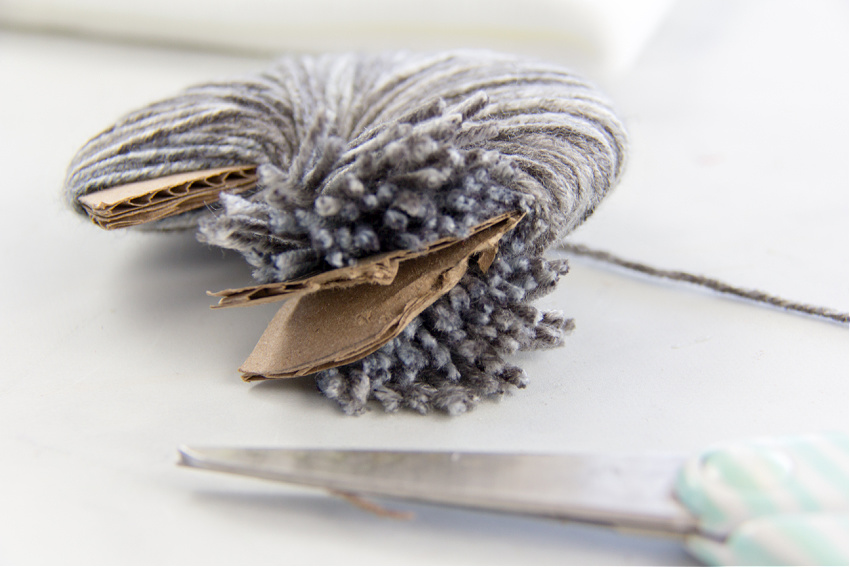 How to cut yarn off a cardboard ring to make a pom pom