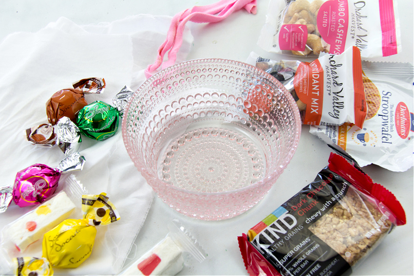 a pink glass bowl with candy to make a gift for a teacher