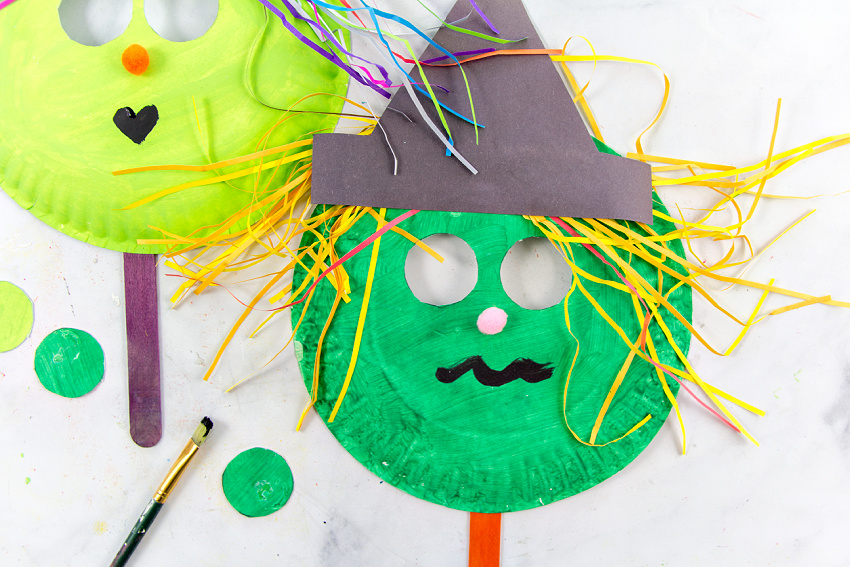 a paper plate mask for halloween that looks like a witch