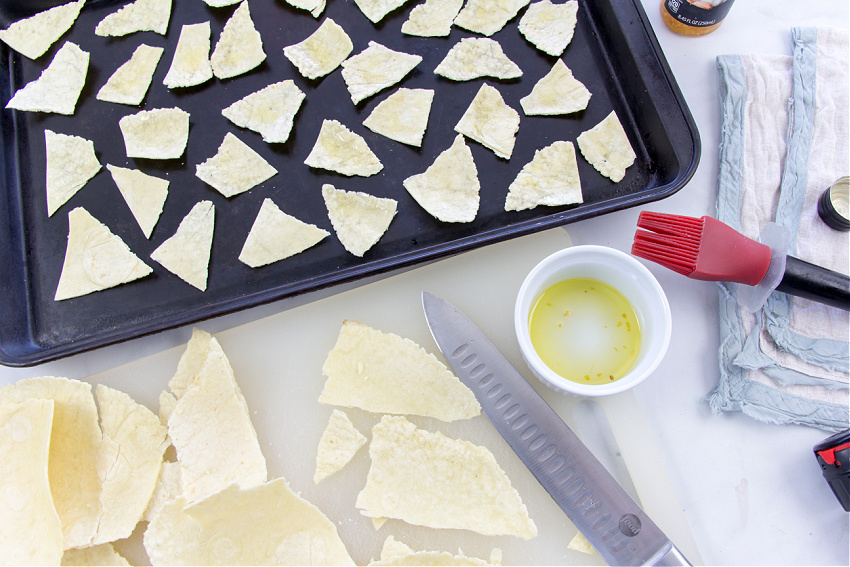 rice flour tortillas cut up on a baking tray to make chips