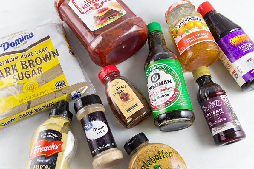 ingredients including mustard, marmalade, brown sugar, ketchup, hoison sauce, boysenberry sauce, soy sauce, hot honey, and onion powder to make boysenberry barbecue sauce