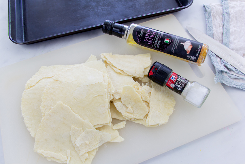 broken rice flour tortillas, sea salt, and garlic infused olive oil to make homemade tortilla chips