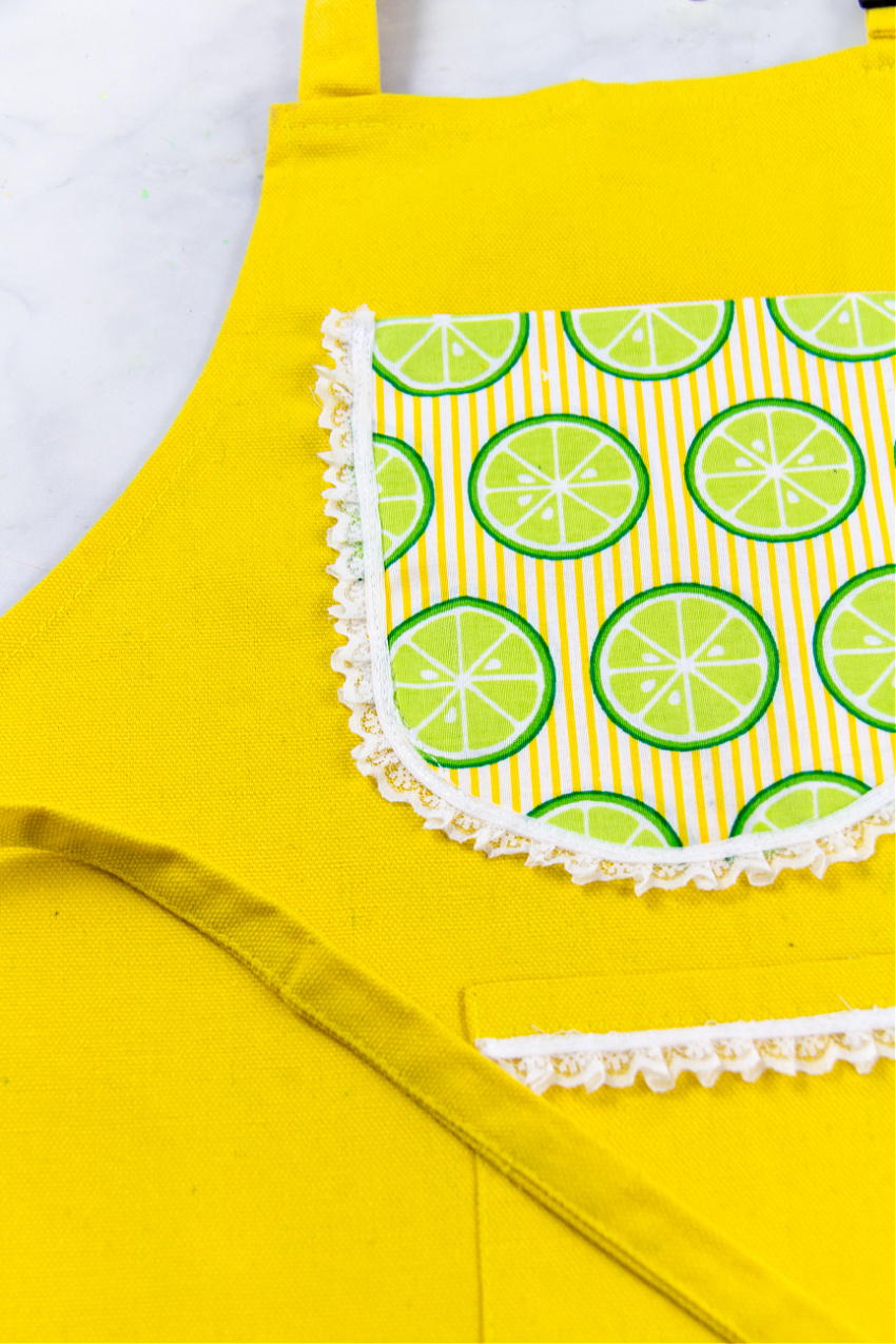 yellow diy apron for kids with limes on it