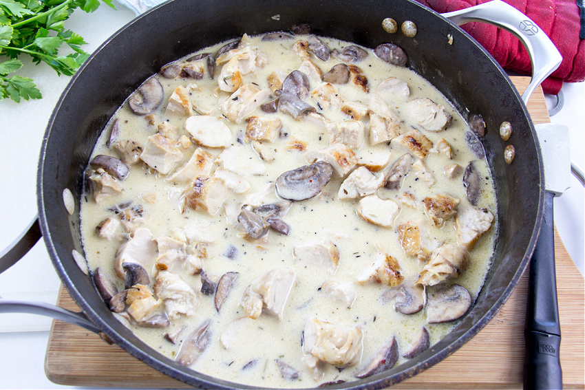 mushrooms and grilled chicken in a white sauce 