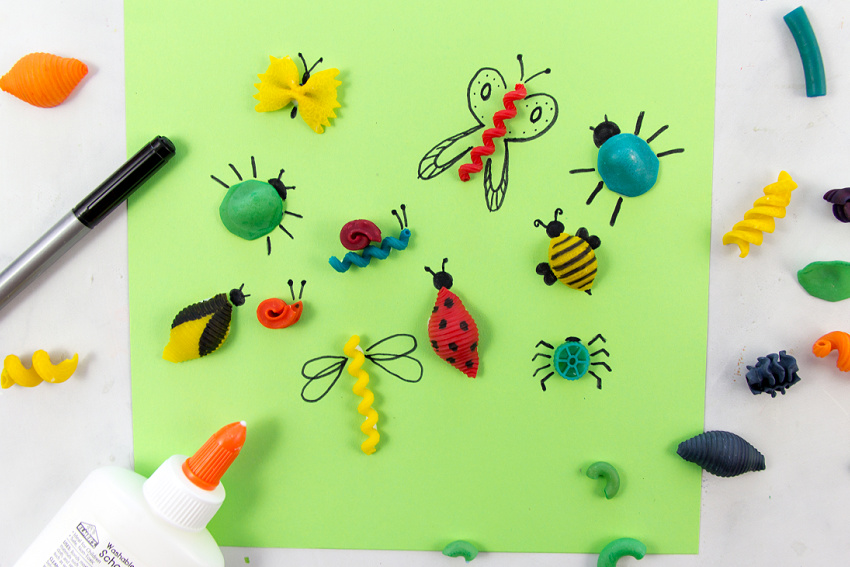 bug crafts made using dyed pasta and a marker