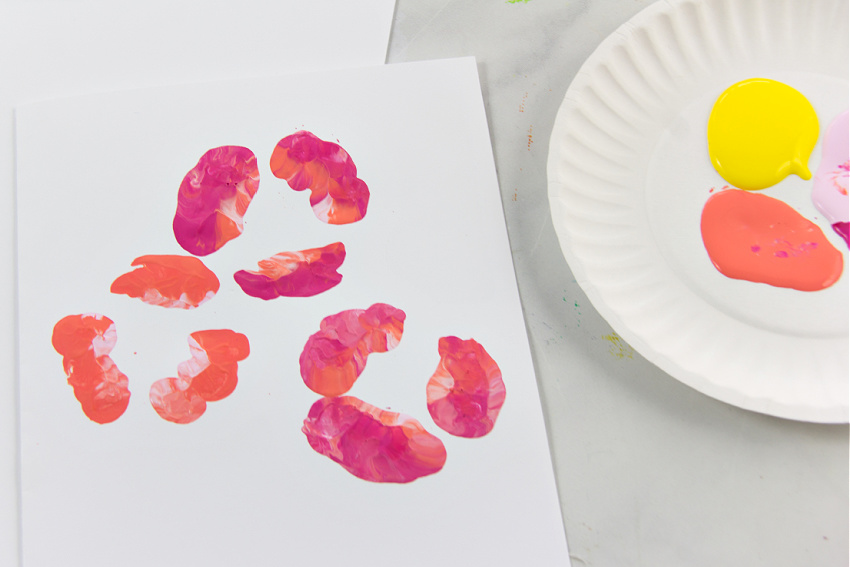 flowers stamped onto card by painting plastic water bottles