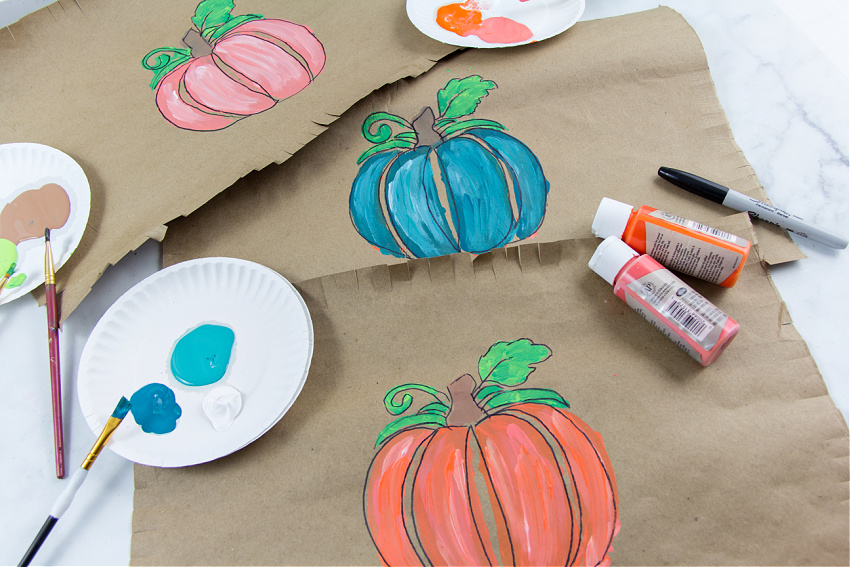 Trace around pumpkins painted on paper with a permanent marker to make them really stand out.