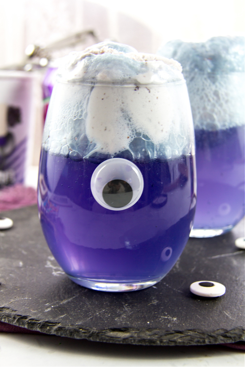 purple mocktail float with a googly eye on front
