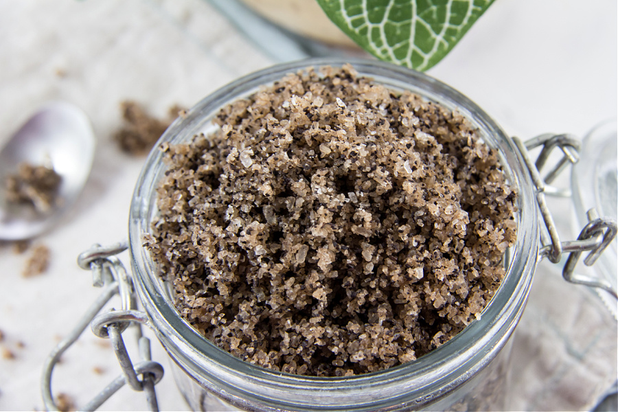 coffee and epsom salt body scrub in a glass jar