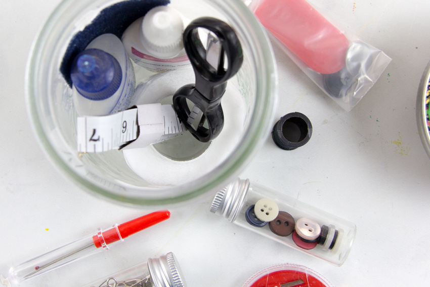 a ball jar filled with small sewing items to gift as a sewing gift