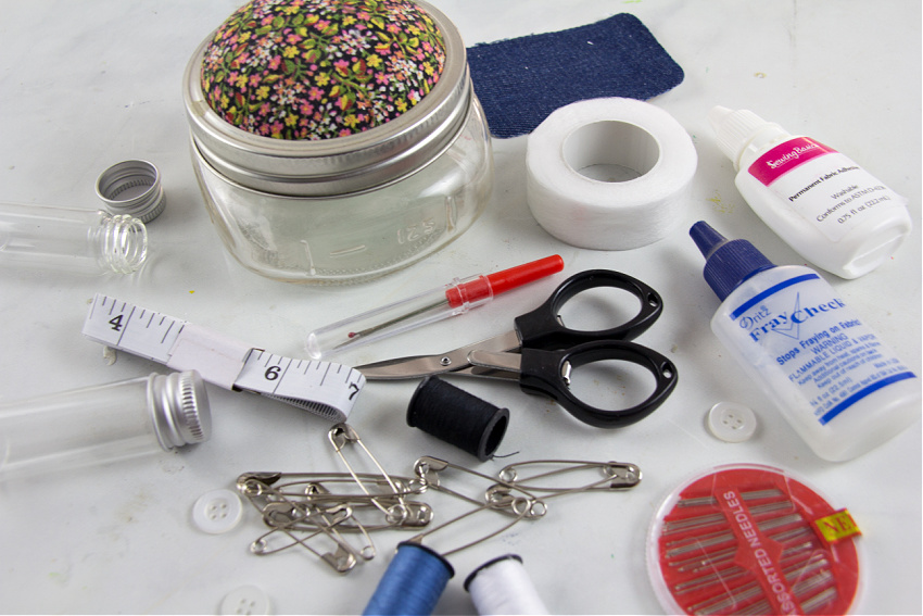 sewing kit list ideas for college students including fray check, fabric glue, scissors, seam ripper, thread, safety pins, tape measure, denim patches.